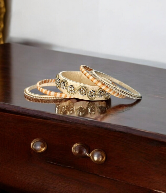 Dhanvi ivory and golden bangles set