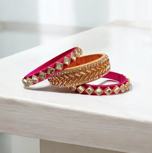Priyal pink and golden silk thread bangles set