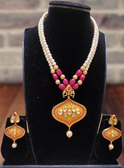 Kimaya faux pearl and maroon beaded necklace set