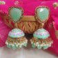 Adah pista green stone jhumka