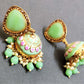 Adah pista green stone jhumka