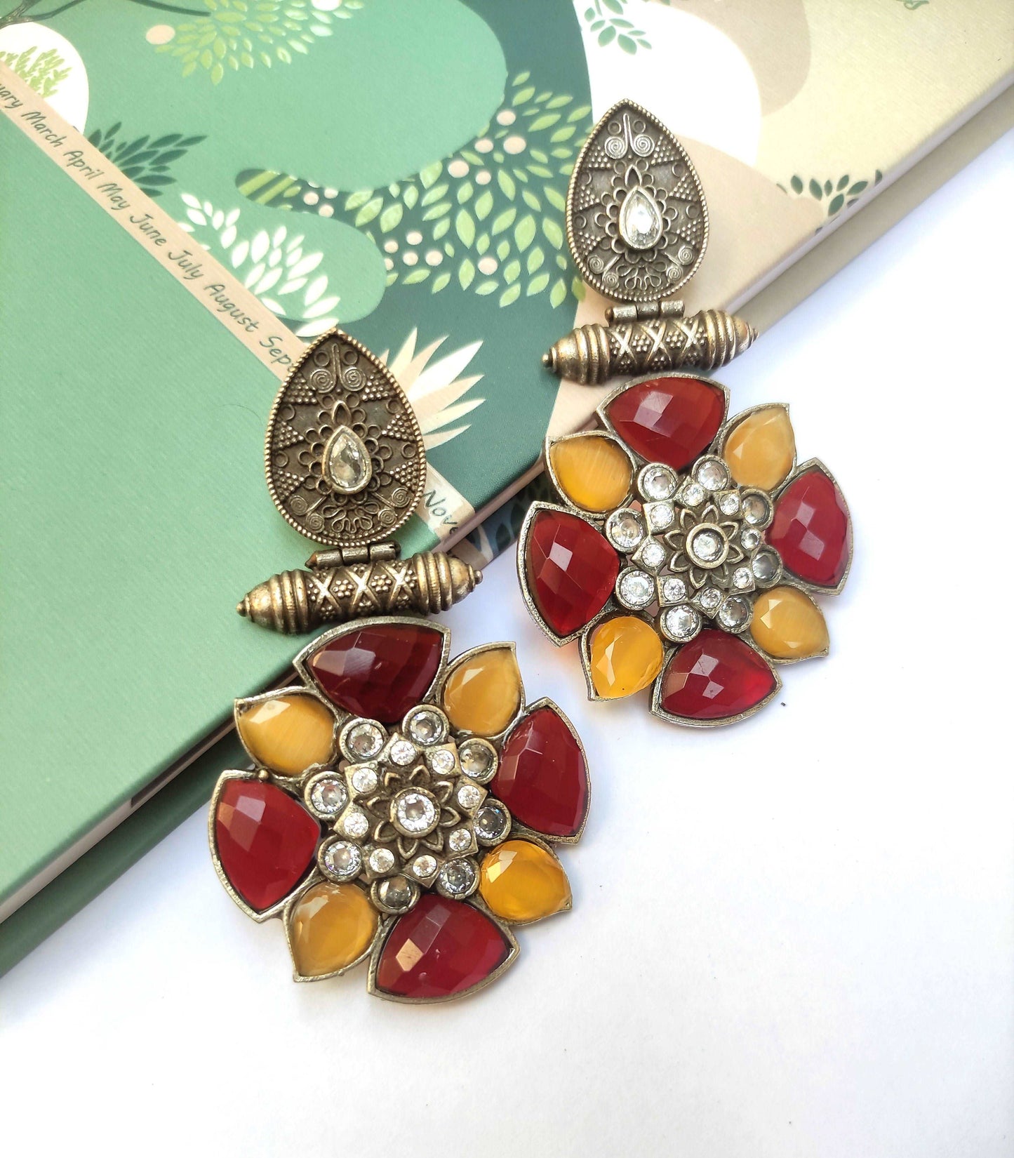 Chandrika pushpa maroon and yellow oxidised studs