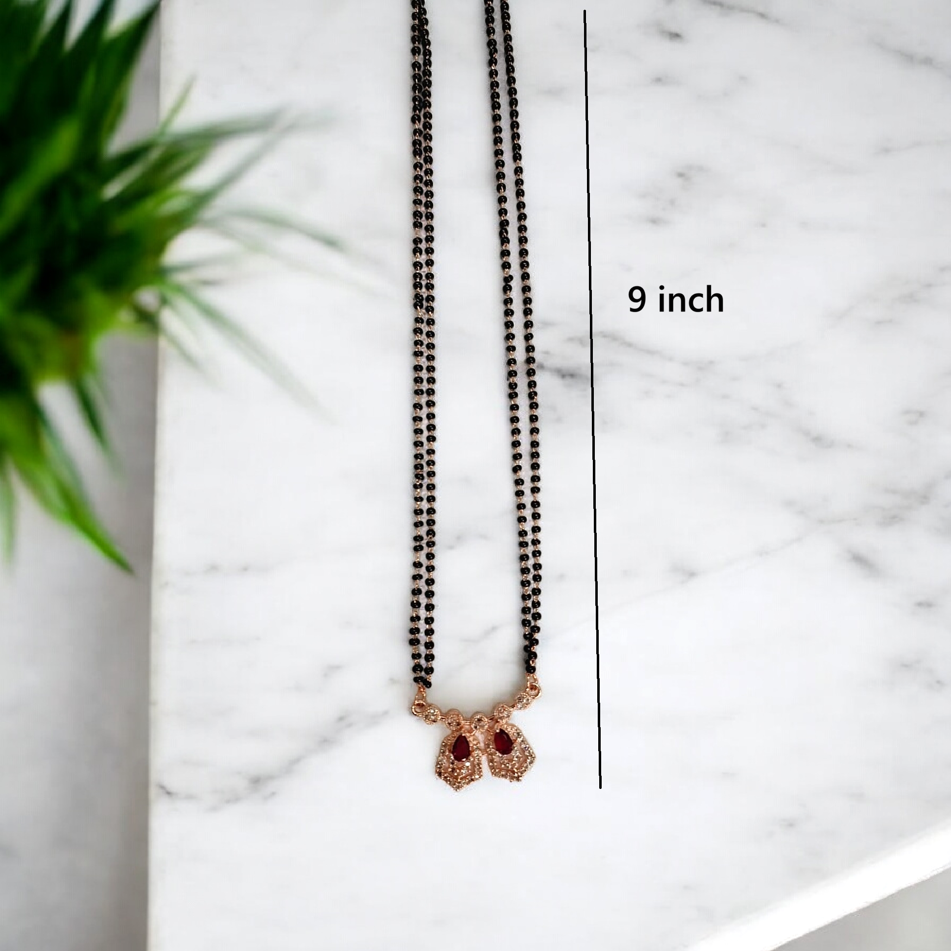 Darshi Ruby hexa - rose gold short mangalsutra featuring ruby red hexagon stone pendant with black beads, modern Indian mangalsutra