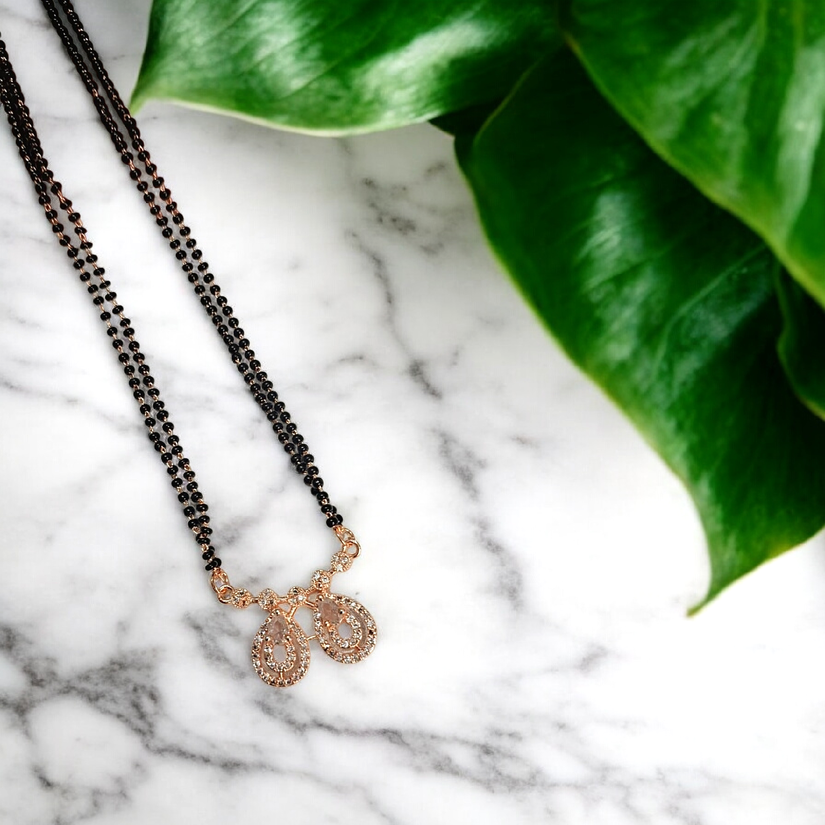 Darshi Teardrop Glow - rose gold short mangalsutra with twin teardrop crystal pendant and black bead chain, elegant everyday mangalsutra