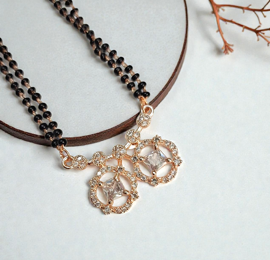 Darshi Twin Bloom – Rose Gold Short Mangalsutra with twin crystal pendant and black bead chain, minimalist daily wear design