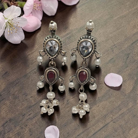 Oxidised red and white stone statement necklace set with pearl drops and matching earrings in antique silver finish ethnic jewellery