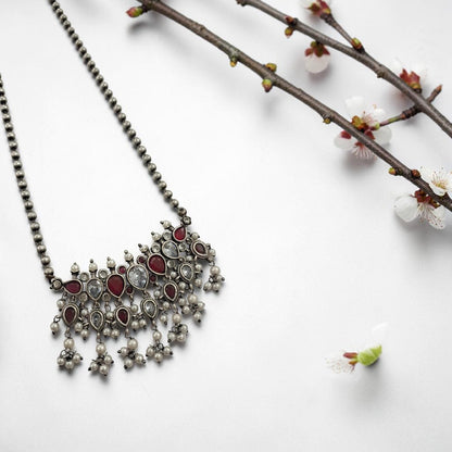 Oxidised red and white stone statement necklace set with pearl drops and matching earrings in antique silver finish ethnic jewellery