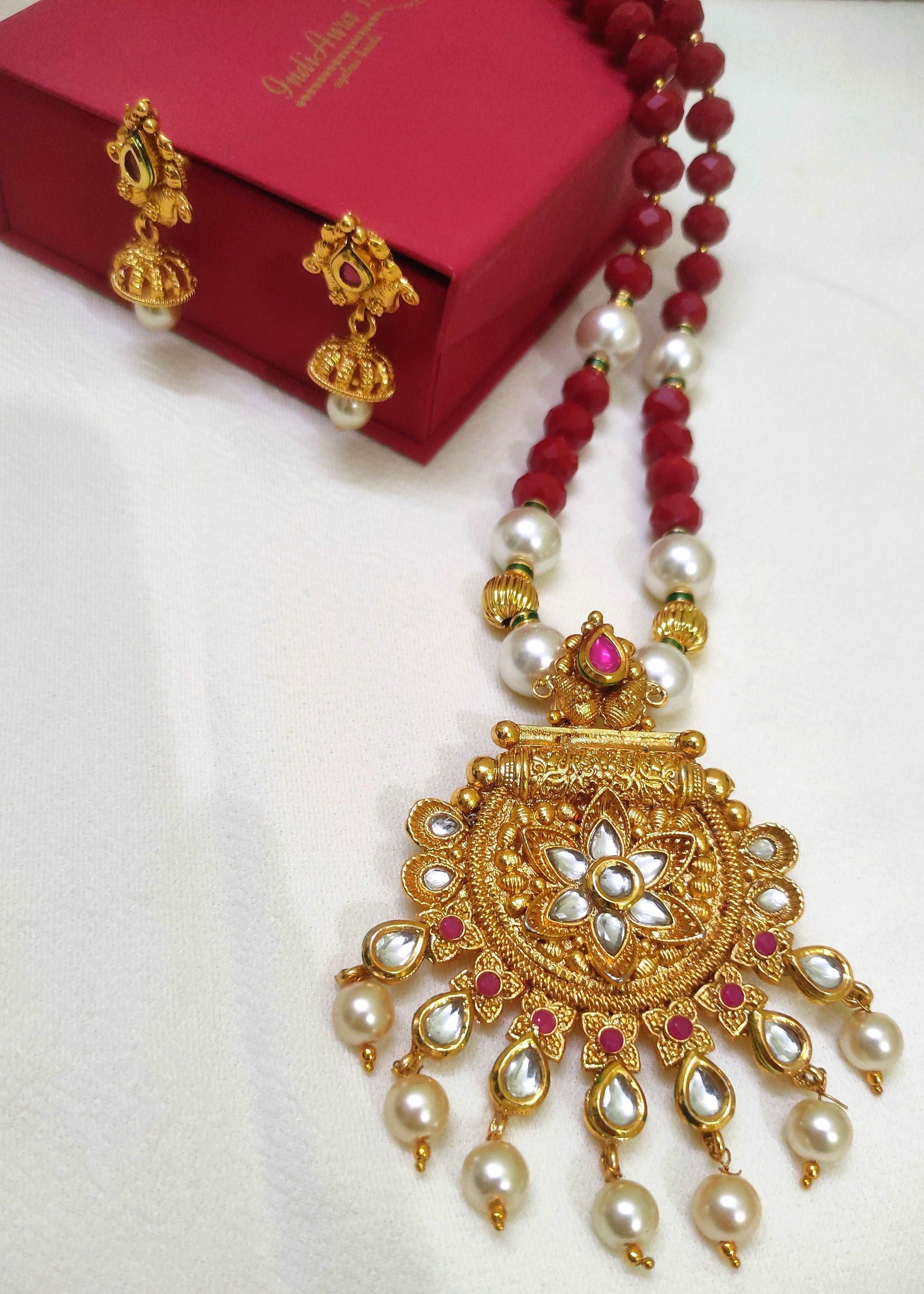 Ishanvi gold plated red beaded traditional necklace set