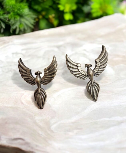 Silver flying Bird Oxidised Studs flat lay on white marble 