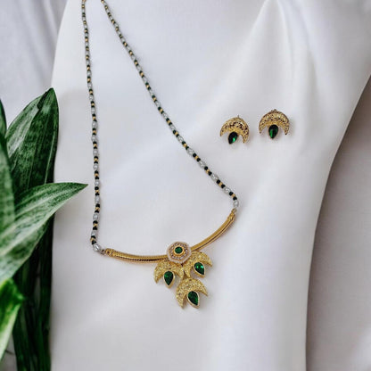 Tarika Chandra gold plated traditional necklace set with green stones and matching earrings for saree and kurti by IndiAura Mode