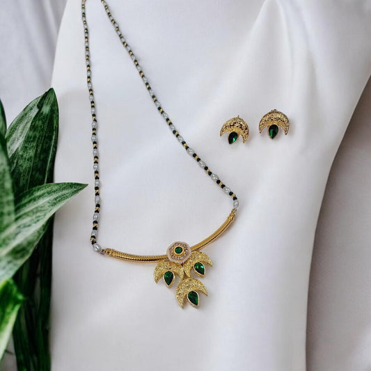 Tarika Chandra gold plated traditional necklace set with green stones and matching earrings for saree and kurti by IndiAura Mode