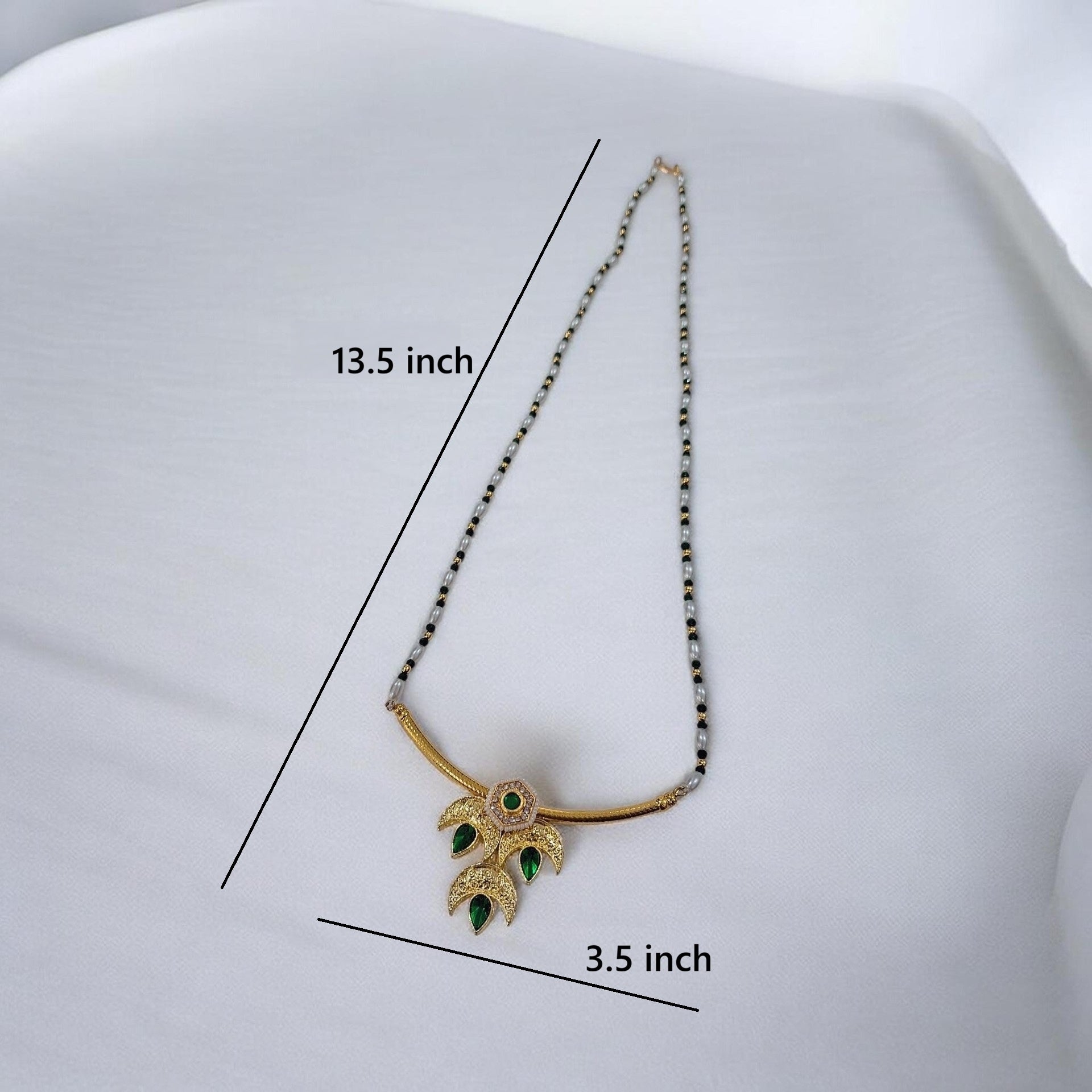 Tarika Chandra gold plated traditional necklace set with green stones and matching earrings with dimentions 13.5 inch long