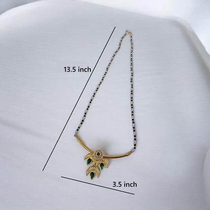 Tarika Chandra gold plated traditional necklace set with green stones and matching earrings with dimentions 13.5 inch long