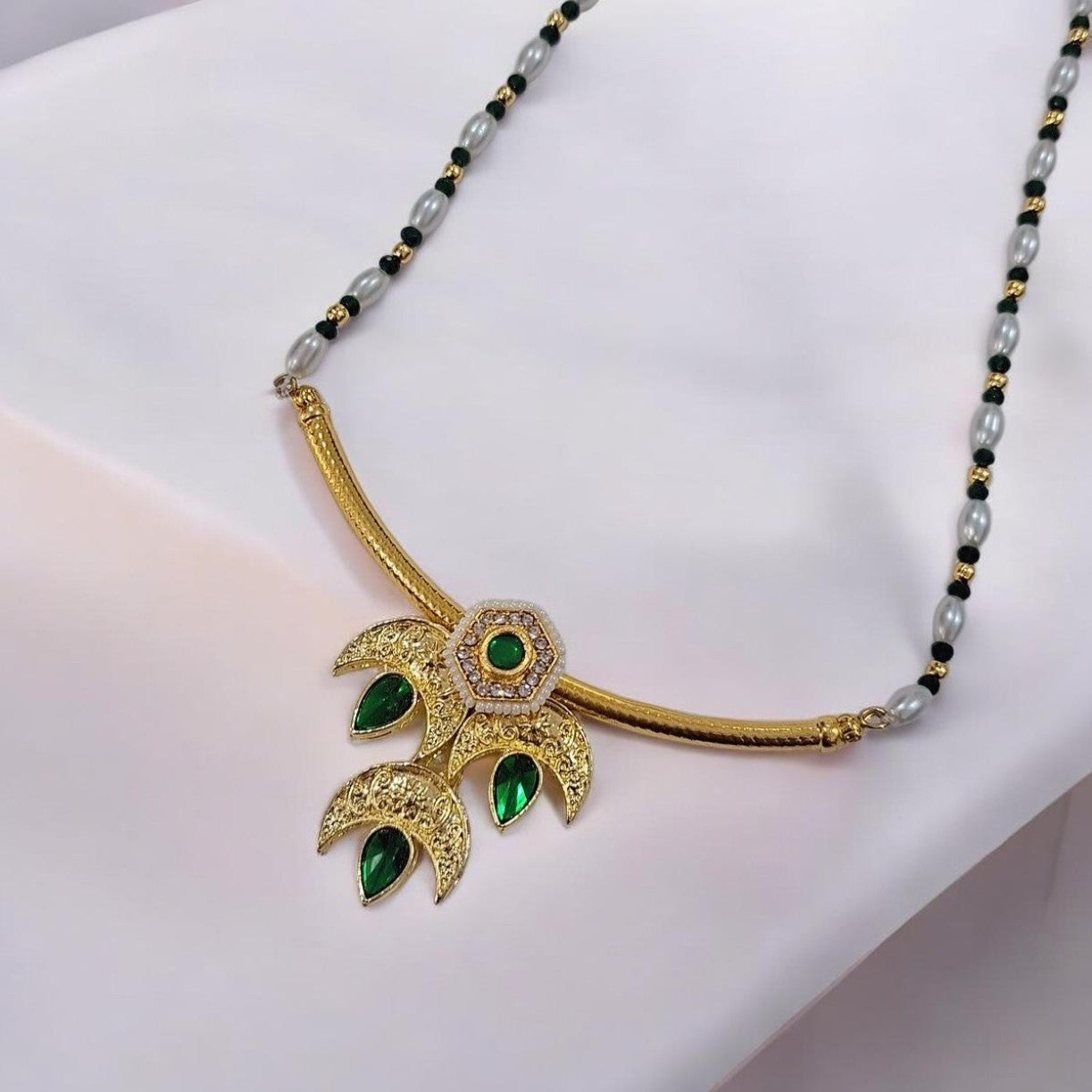 Tarika Chandra gold plated traditional necklace set with green stones for saree and kurti