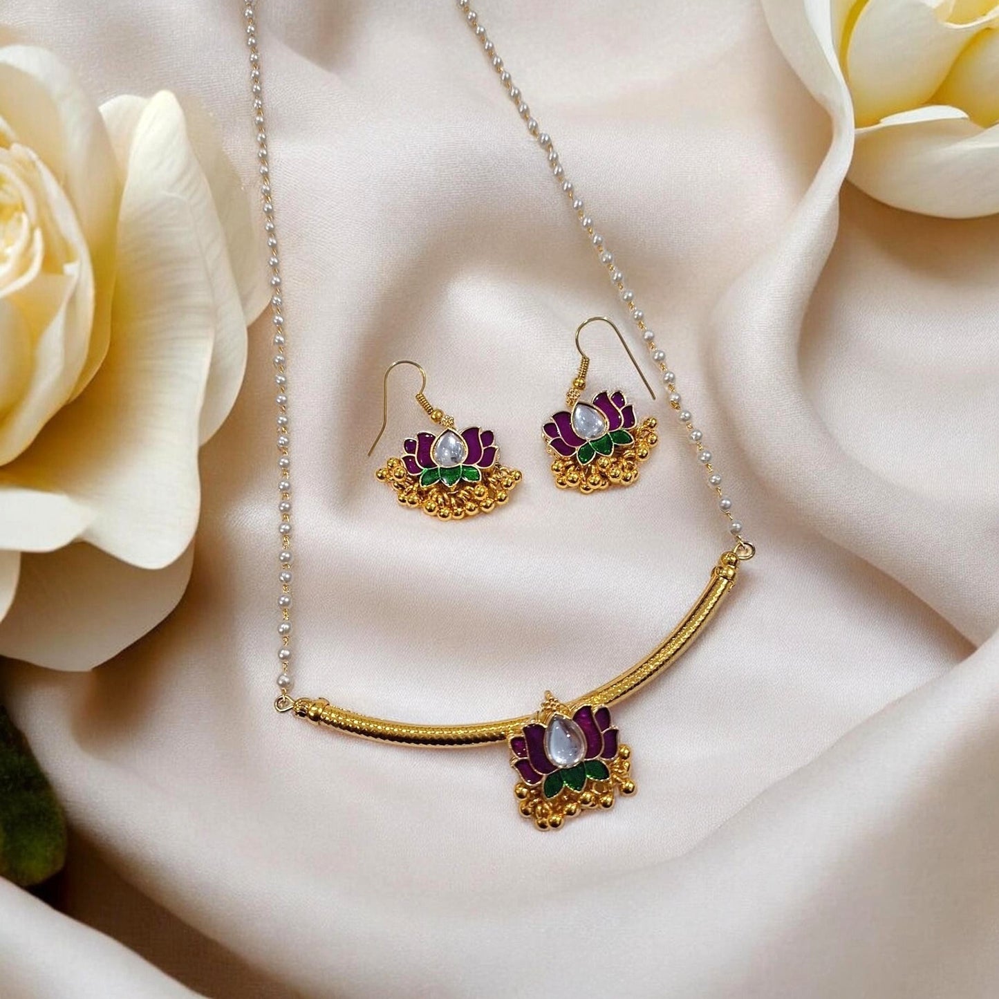 Tarika Padma Gold Plated lotus pendant necklace set with matching earrings in gold finish by Indiaura Mode