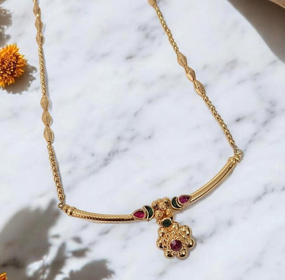 Gold finish Maharashtrian pendant necklace set with ruby and green stones for women