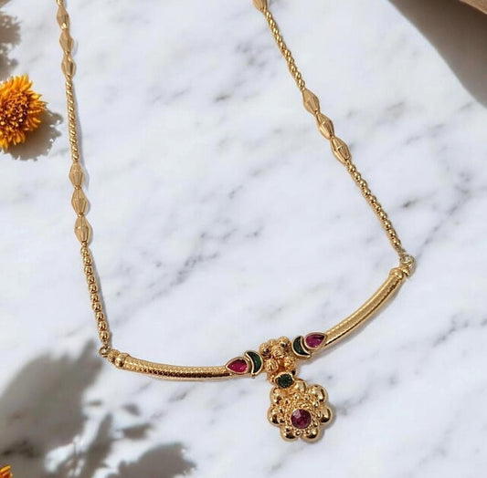 Gold finish Maharashtrian pendant necklace set with ruby and green stones for women