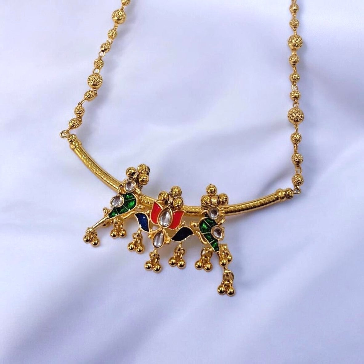 Tarika Rangoli colourful gold plated necklace set with multicolour enamel detailing  by Indiaura Mode