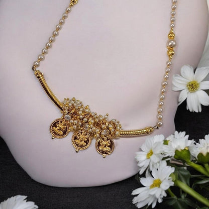 Tarika Shree gold plated Maharashtrian necklace set with Lakshmi coin charms, pearl detailing  by Indiaura Mode