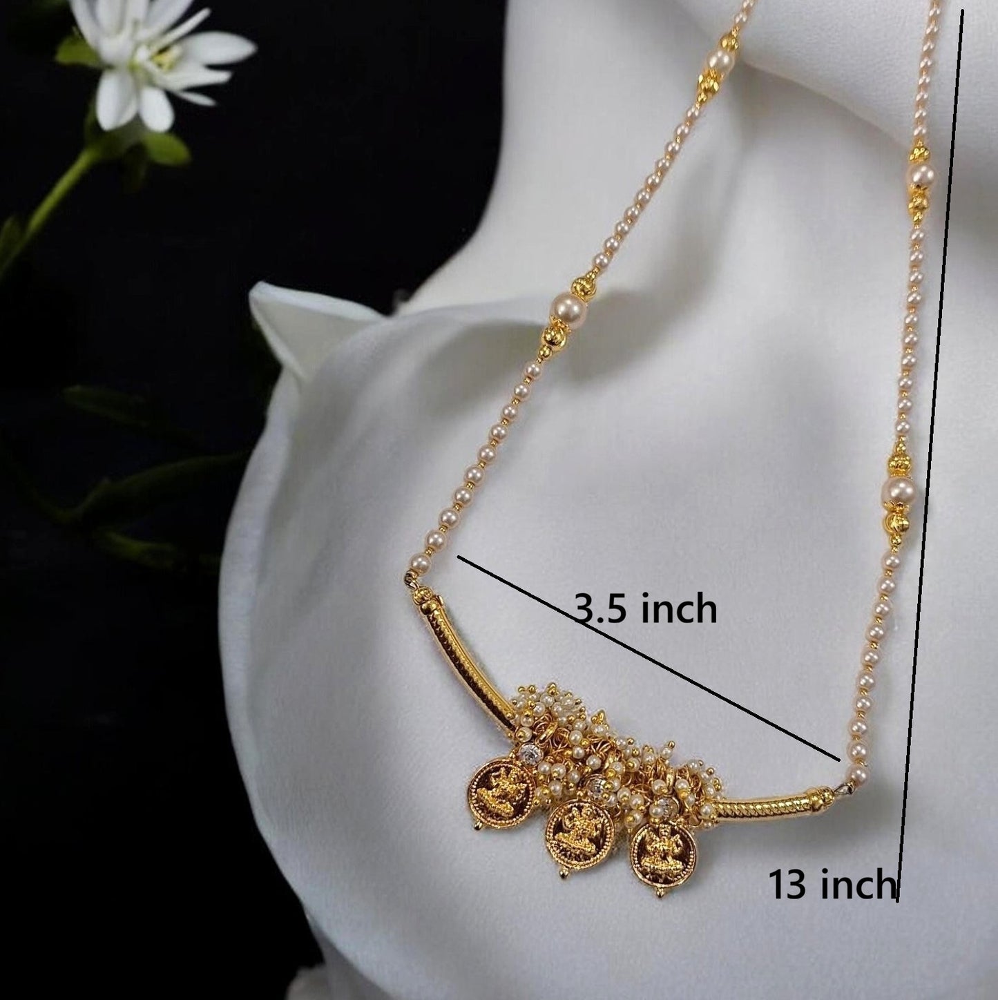 Gold and pearl necklace displayed on a white satin mannequin bust, with measurement lines and text indicating a 3.5 inch width and 13 inch length.