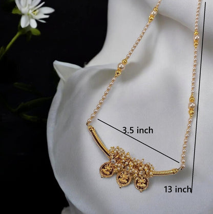 Gold and pearl necklace displayed on a white satin mannequin bust, with measurement lines and text indicating a 3.5 inch width and 13 inch length.