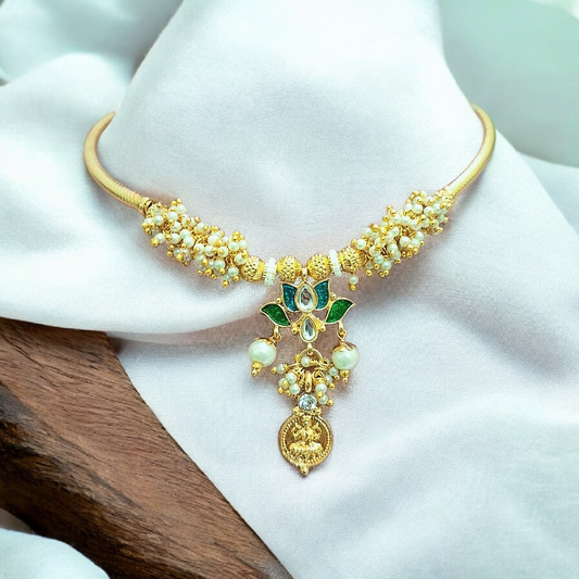 Lakshmi coin pearl choker necklace set with green stones and matching earrings, handmade temple jewelry from India